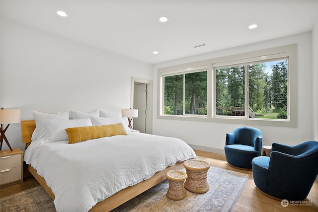 bedroom with hardwood / wood-style flooring