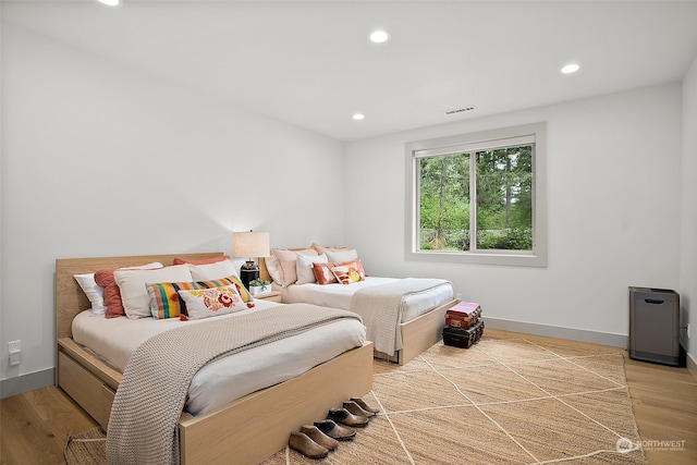 bedroom with light hardwood / wood-style floors