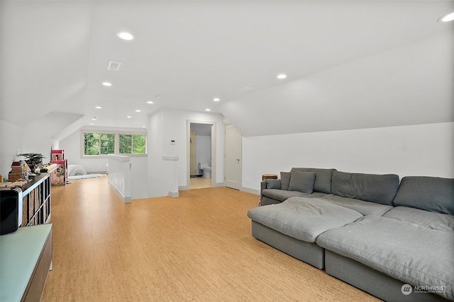 living room featuring light hardwood / wood-style flooring and lofted ceiling