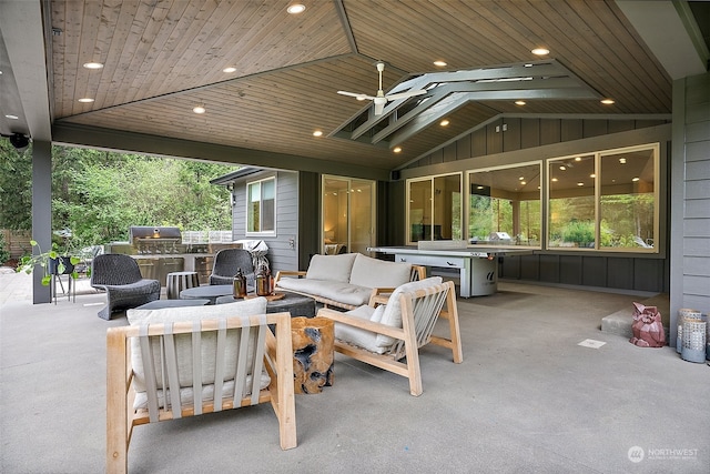 view of patio featuring area for grilling and a grill