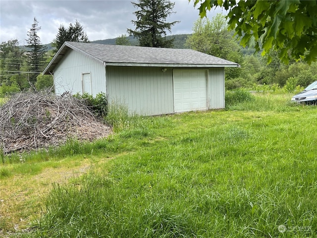 view of outdoor structure with a garage