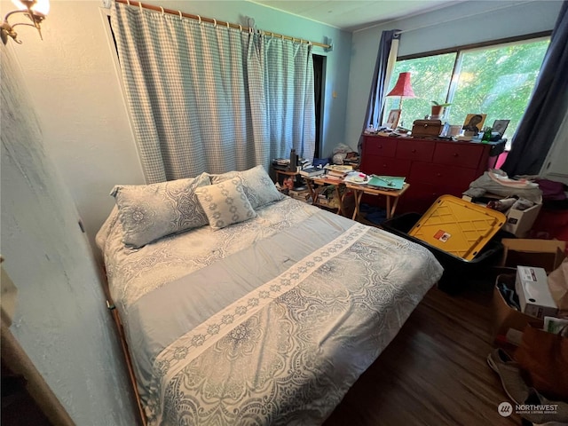 bedroom featuring wood-type flooring