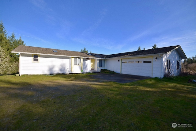 single story home featuring a garage and a front yard