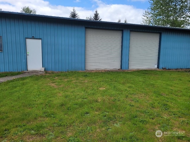 garage featuring a yard