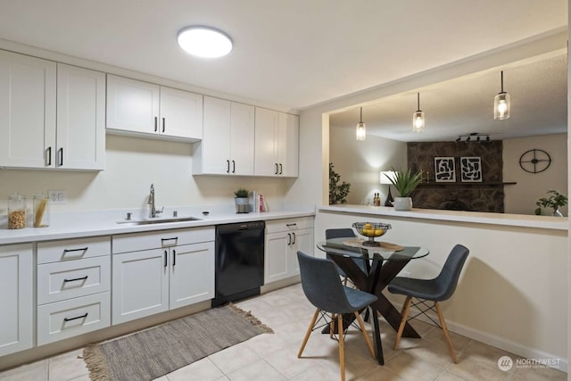 kitchen featuring sink, dishwasher, white cabinets, and light tile floors