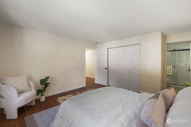 bedroom with dark hardwood / wood-style floors, a closet, and a textured ceiling