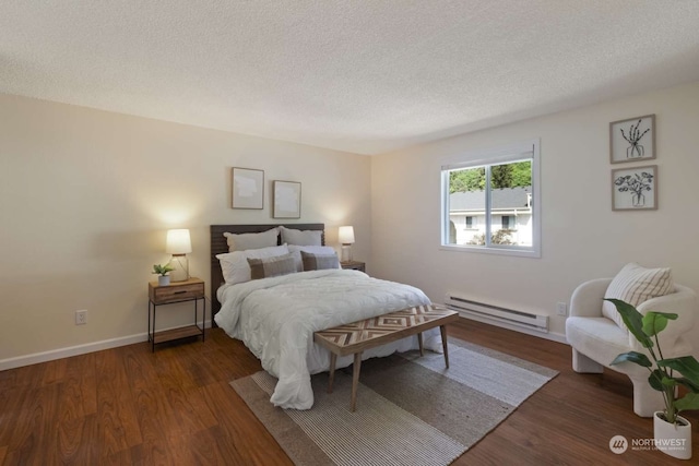 bedroom with a baseboard radiator, dark wood-type flooring, and a textured ceiling