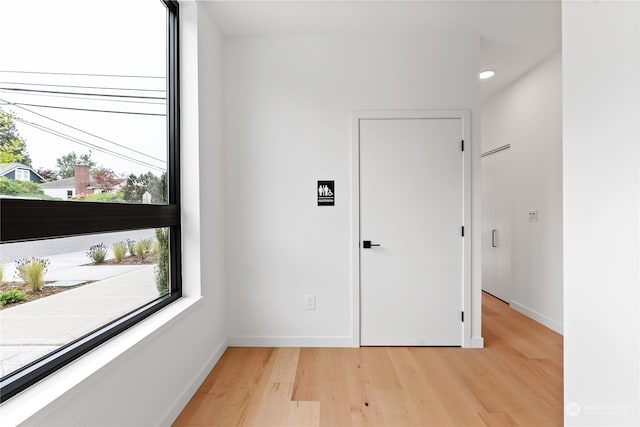 unfurnished room featuring light wood-type flooring