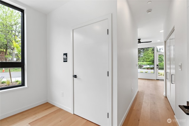 hallway with light wood-type flooring