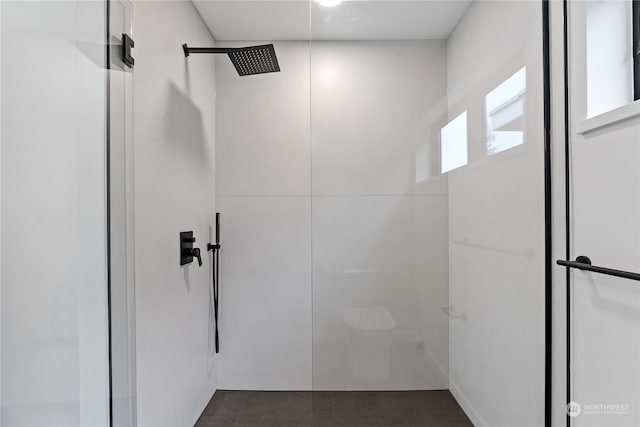 bathroom with tile floors and an enclosed shower