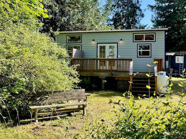 rear view of house featuring a deck