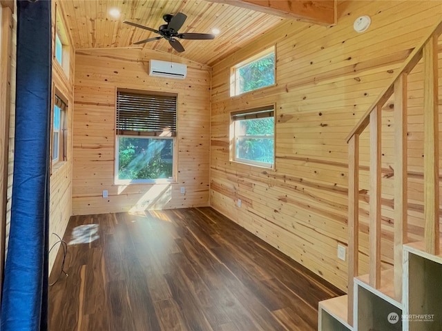 spare room featuring wooden walls, hardwood / wood-style flooring, and wood ceiling