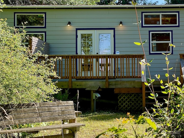 back of house featuring a wooden deck