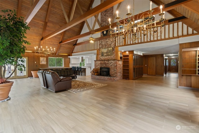 living room with a brick fireplace, beam ceiling, light wood-type flooring, high vaulted ceiling, and wooden walls