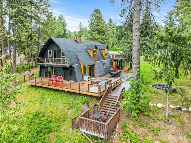 back of house with a wooden deck