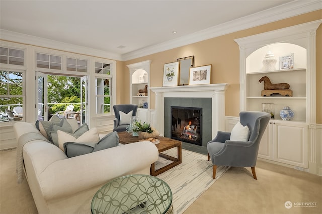 living room with light carpet, crown molding, a fireplace, and plenty of natural light