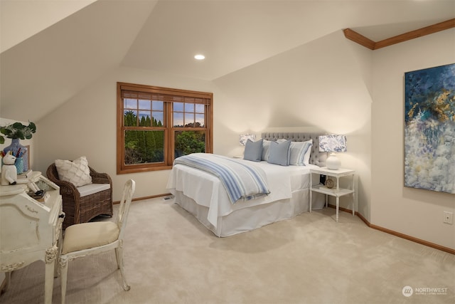 bedroom with vaulted ceiling and carpet flooring