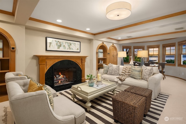 carpeted living room with ornamental molding and a fireplace