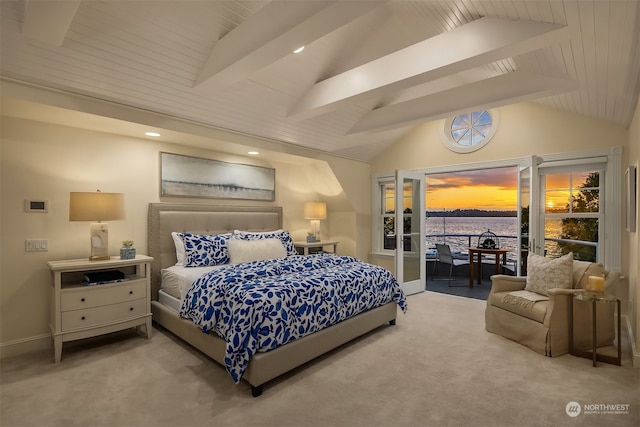 carpeted bedroom with access to outside, vaulted ceiling with beams, and a water view