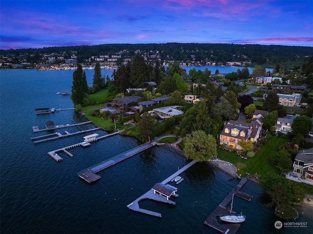 aerial view at dusk with a water view