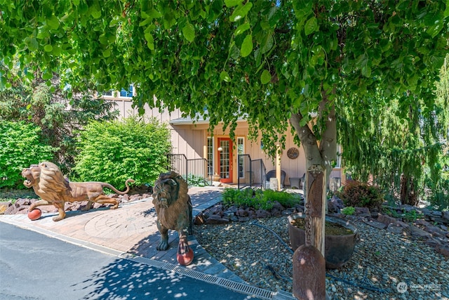 view of property hidden behind natural elements