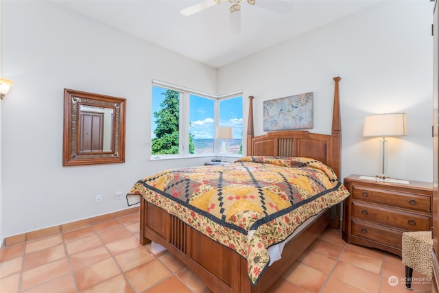 tiled bedroom with ceiling fan