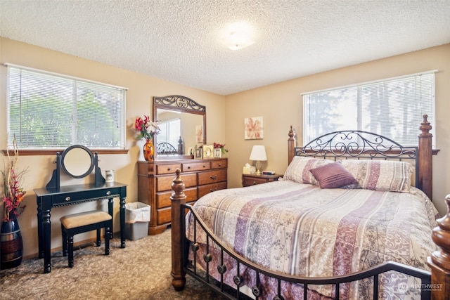 carpeted bedroom with a textured ceiling