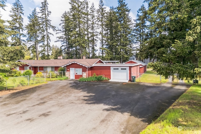 single story home featuring a garage