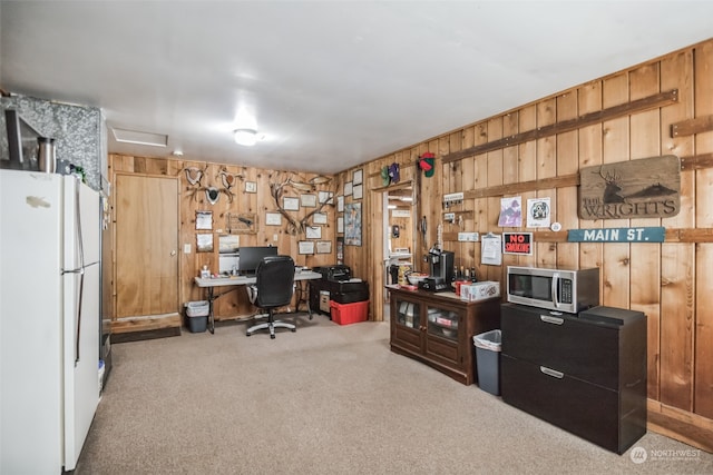 home office featuring wooden walls and carpet flooring