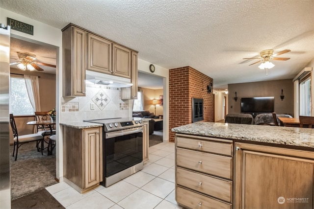 kitchen with ceiling fan, tasteful backsplash, electric stove, light stone counters, and light colored carpet