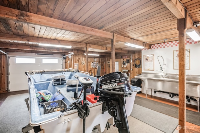 garage with wooden ceiling and wood walls