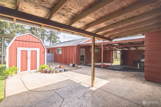 view of patio / terrace with a shed