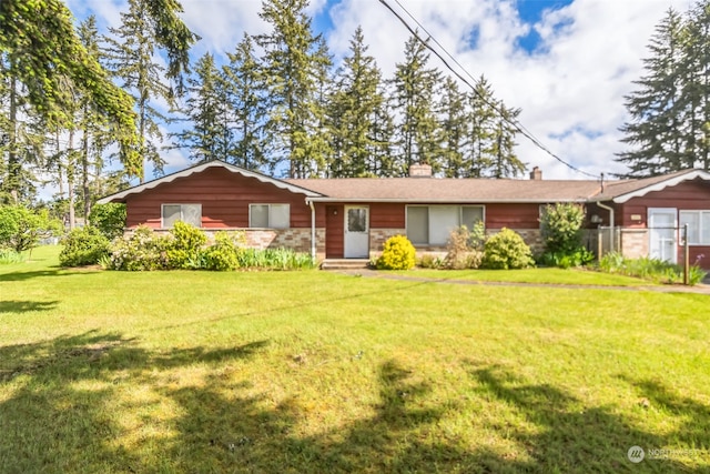 ranch-style house featuring a front lawn