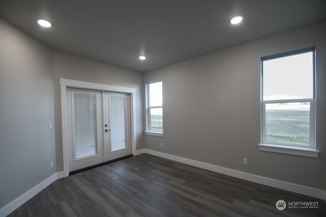 unfurnished bedroom with dark hardwood / wood-style flooring and a closet