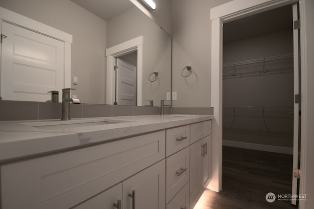 bathroom with hardwood / wood-style floors and vanity