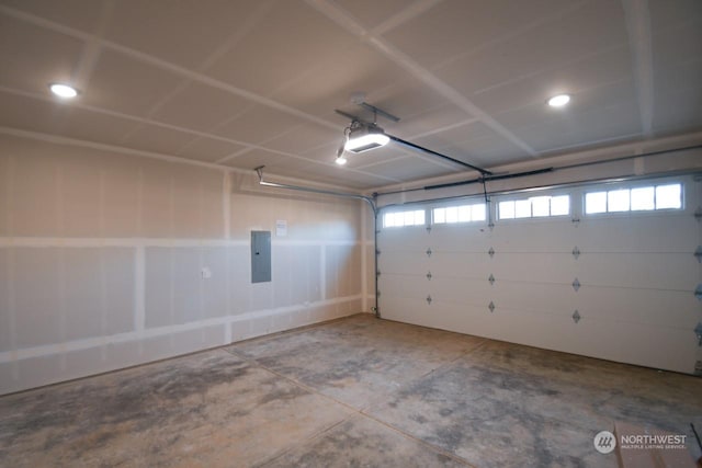 garage with electric panel and a garage door opener