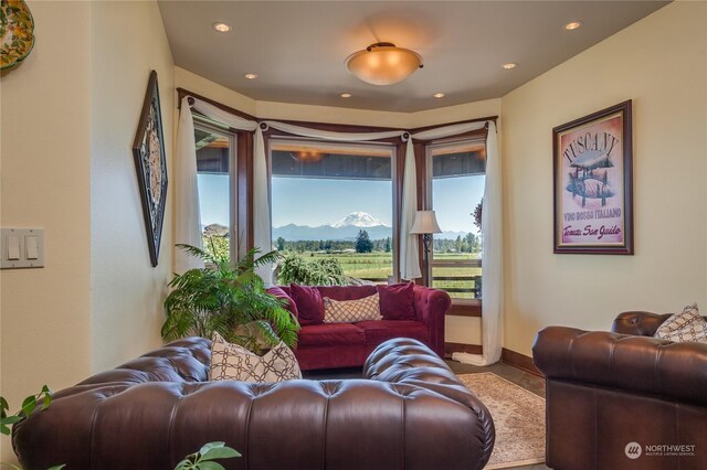 tiled living room featuring a mountain view