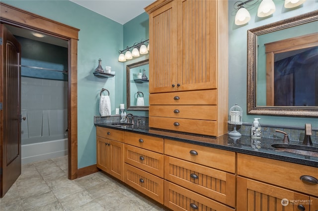 bathroom featuring dual vanity, tile patterned flooring, and shower / bathing tub combination