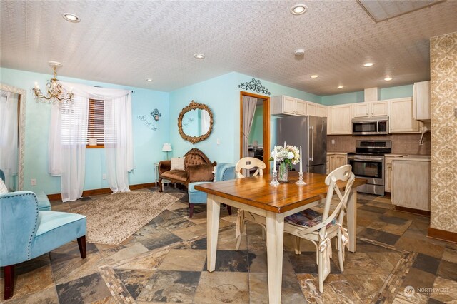 tiled dining space with a notable chandelier