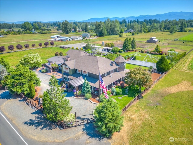 birds eye view of property with a mountain view and a rural view