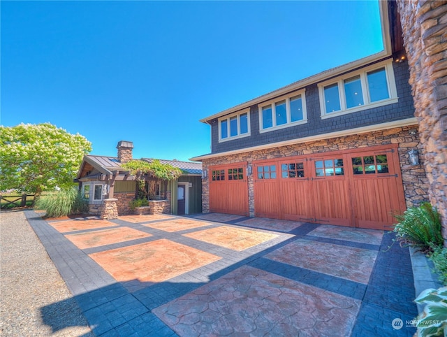 view of front of property featuring a garage