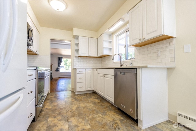 kitchen featuring white cabinetry, stainless steel appliances, sink, and baseboard heating