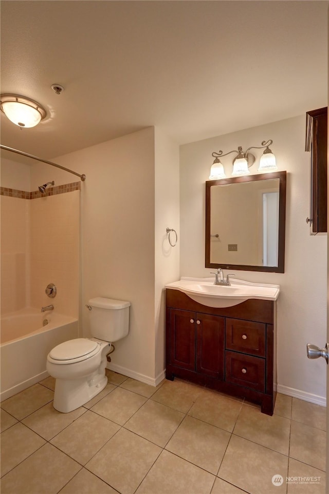 full bathroom with toilet, vanity, tile patterned floors, and tiled shower / bath