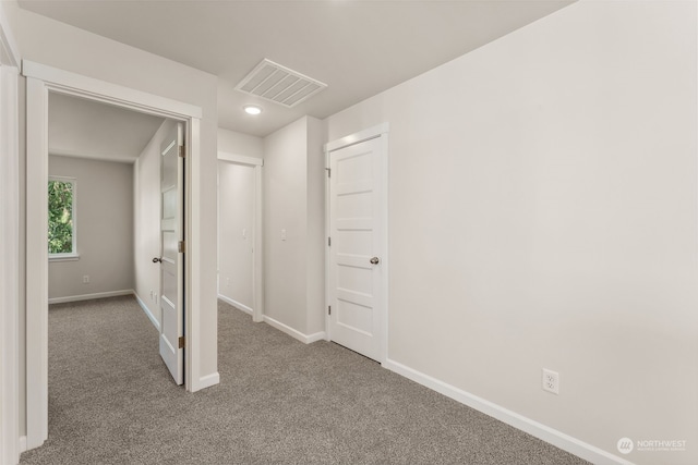 hallway featuring carpet flooring