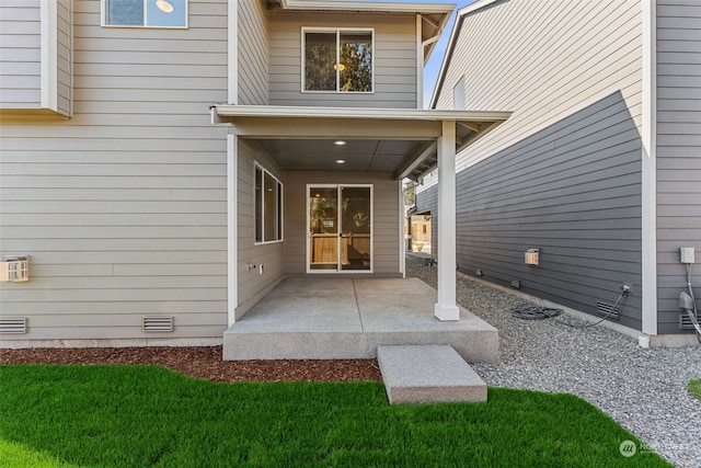 property entrance featuring a patio