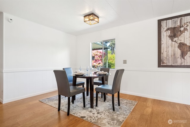 dining space with light hardwood / wood-style flooring