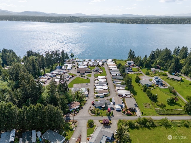 birds eye view of property featuring a water and mountain view