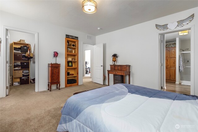 bedroom with carpet and connected bathroom