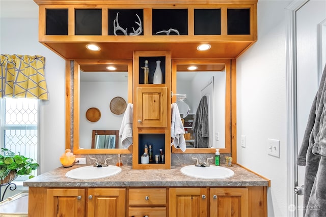 bathroom featuring dual vanity