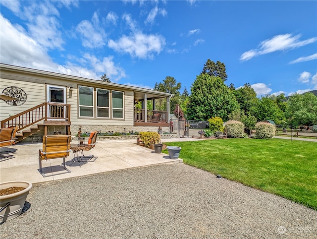 exterior space featuring a patio area and a lawn